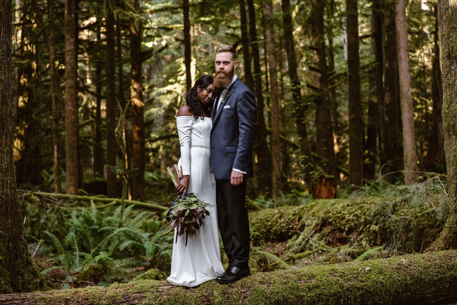 Bride and Groom hiking in forest at Olympic National Park Elopement